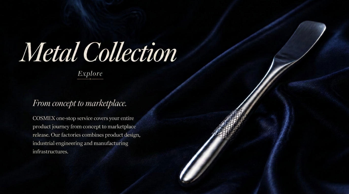 A polished metal gua sha and sculpted spatulas catching cool steel-blue light on dark stone